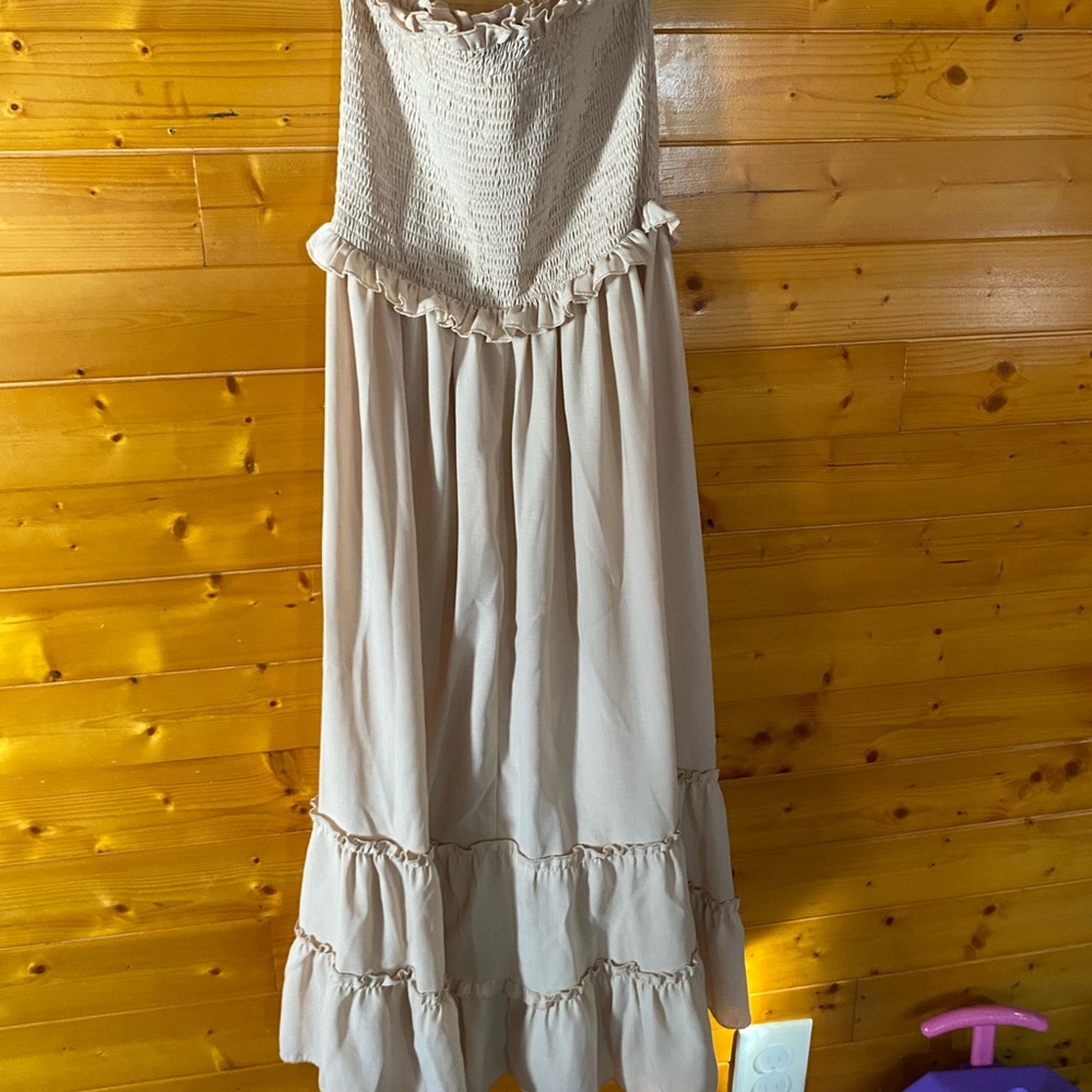 Cute tan summer dress perfect for beach trips.